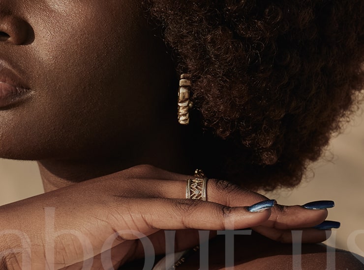 Jewellery artisan arranging gold pieces